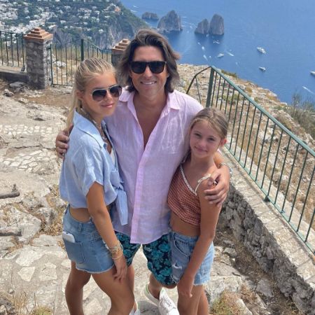 Alexa Louise Florence Hughes and her sibling took a picture with their father Chris Hughes.